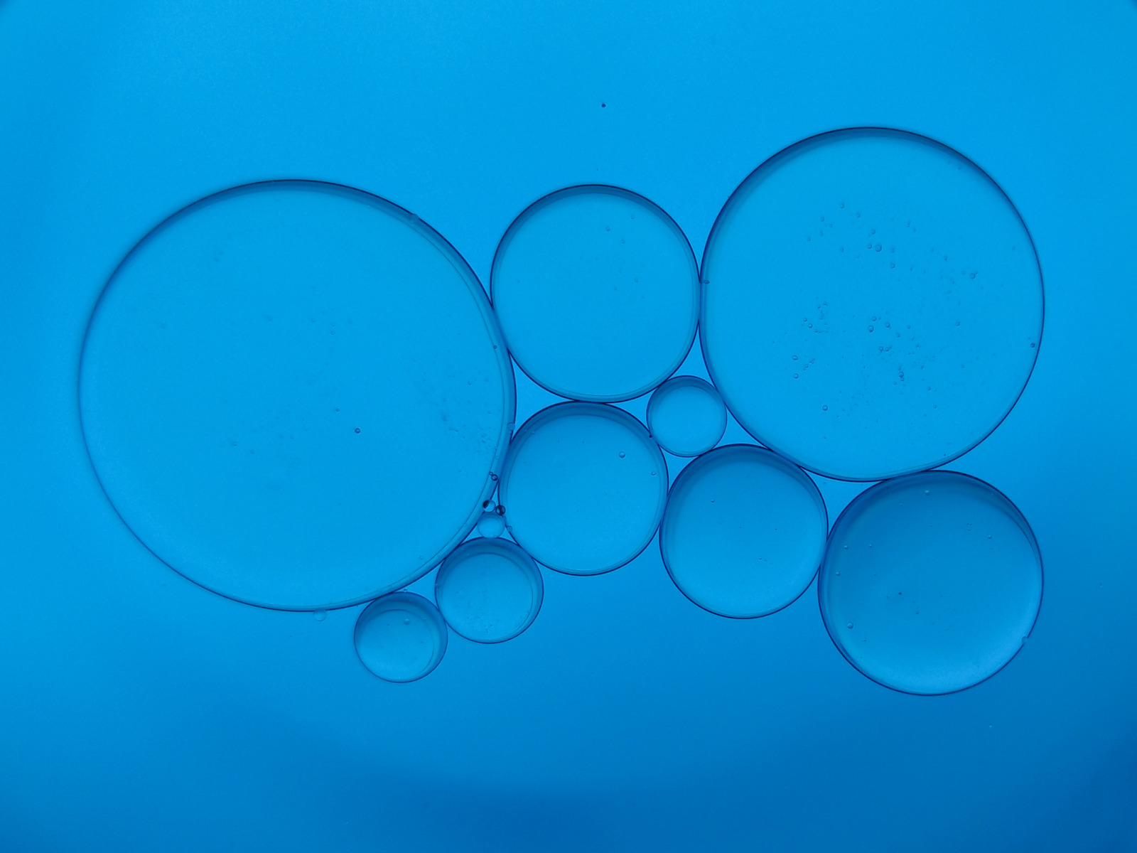 oil-drops-on-blue-background