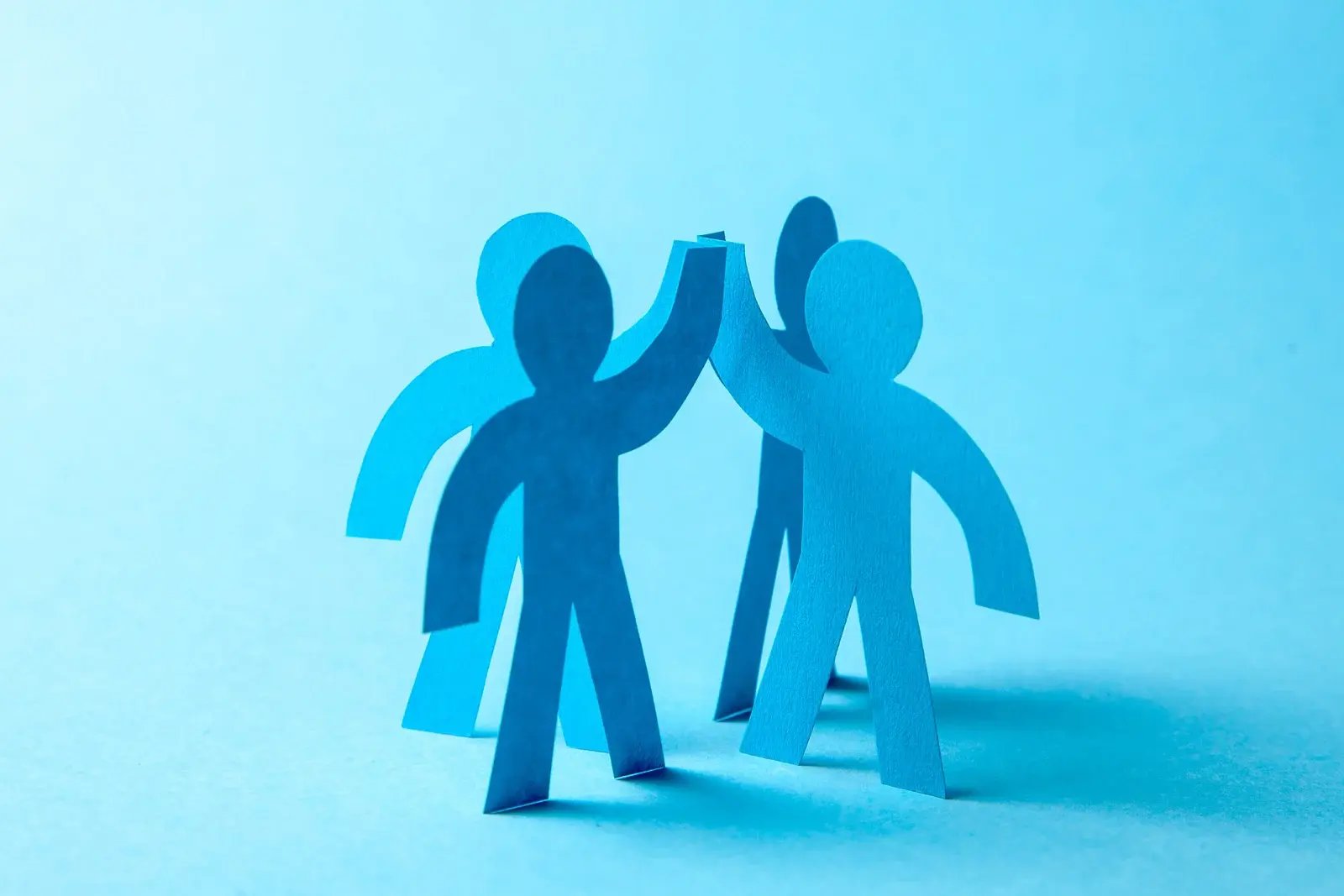 successful-business-team-winner-give-five-team-building